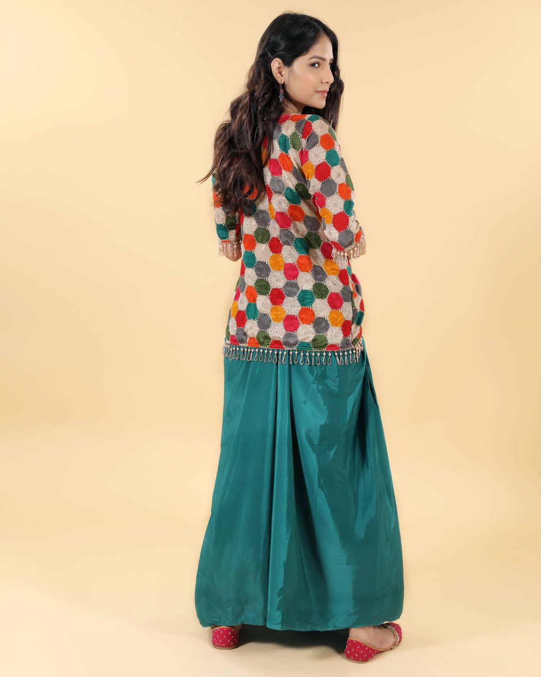 Green slit skirt with multicolour cut blouse